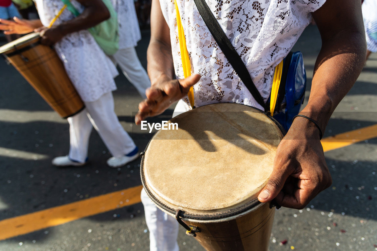 Members of a percussion group are seen playing during fuzue, pre-carnival 