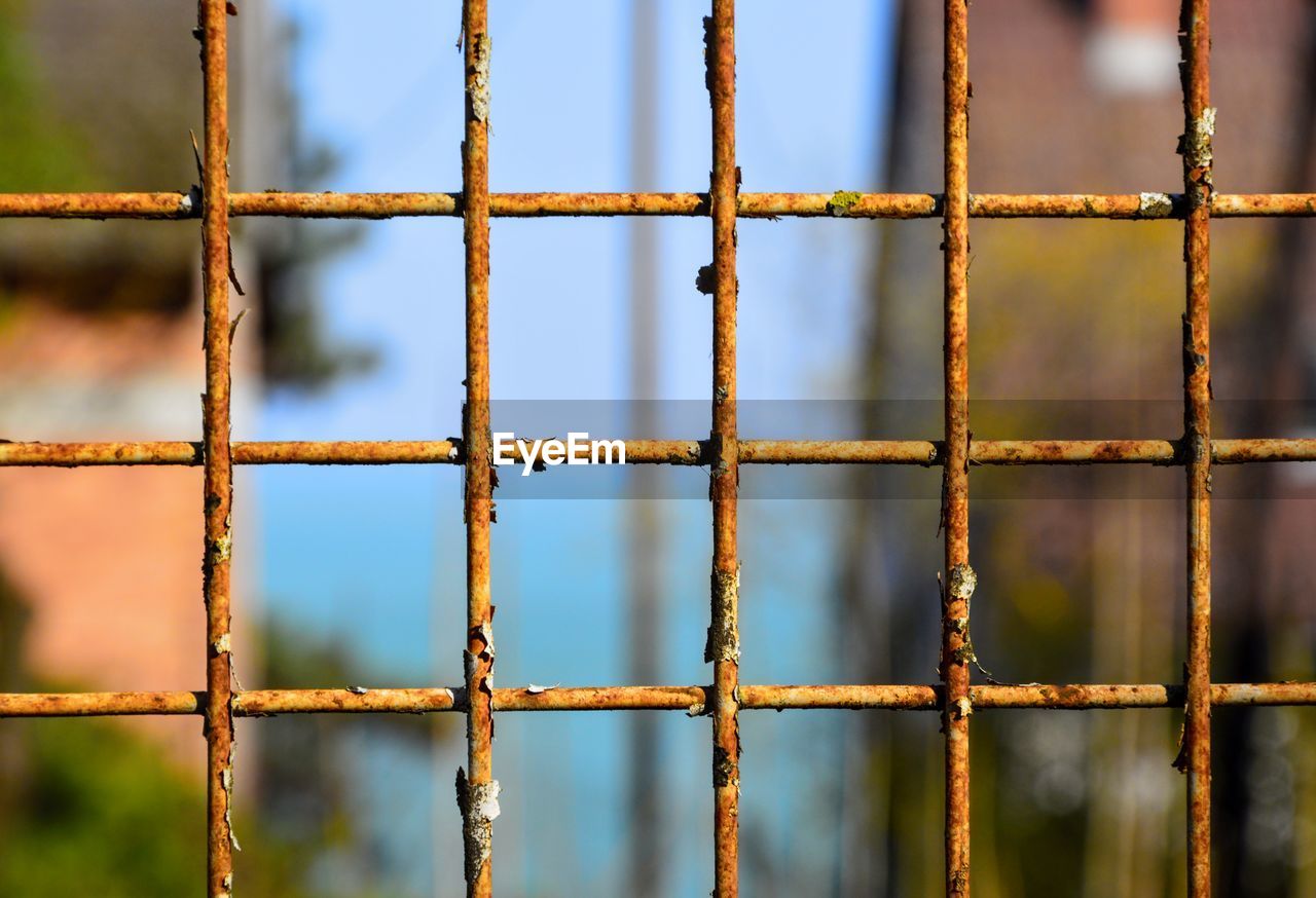 Full frame shot of rusty metallic fence