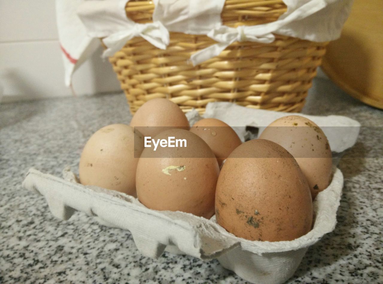 Close-up of eggs in container on table