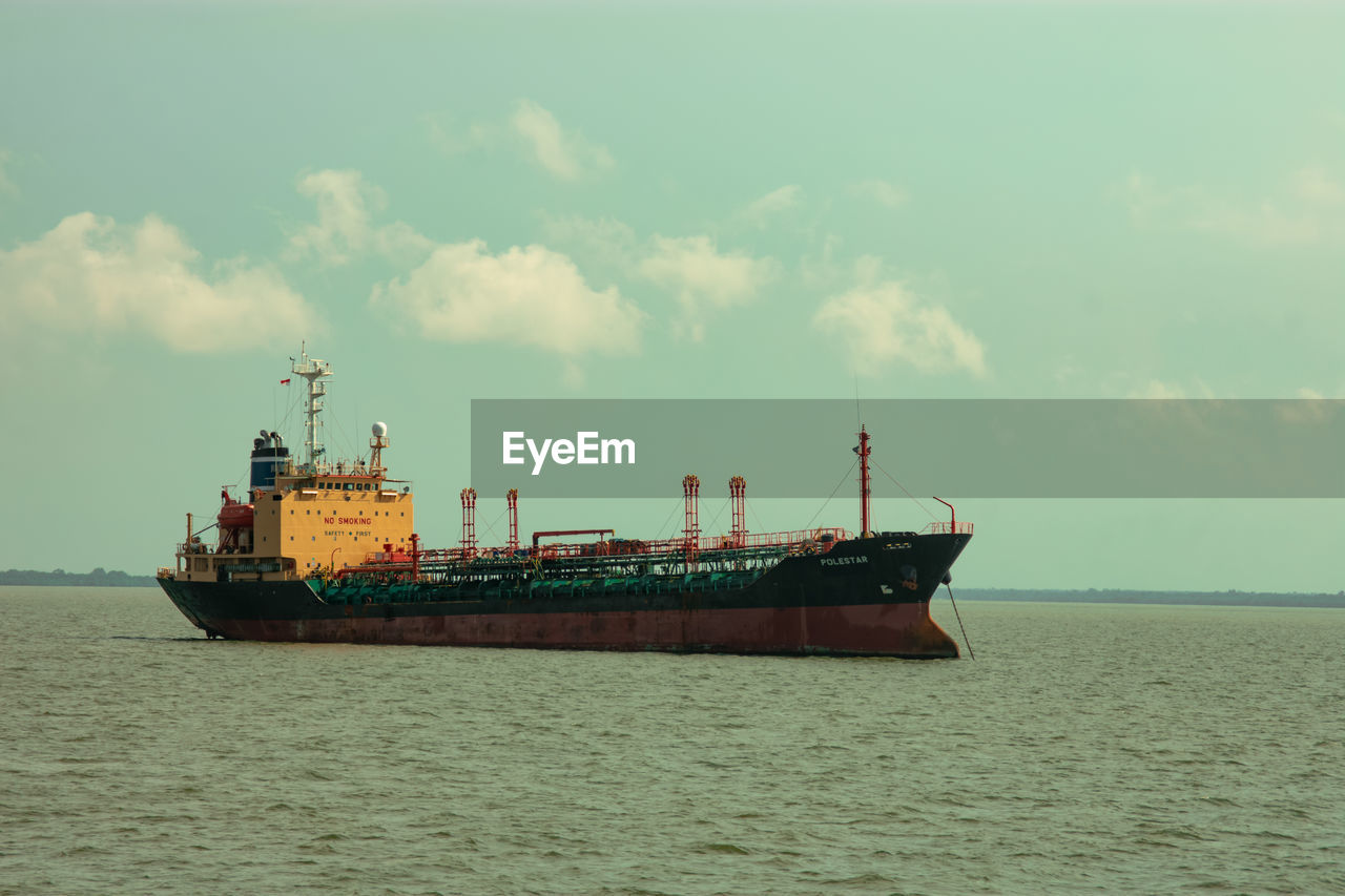 SHIP AT SEA AGAINST SKY