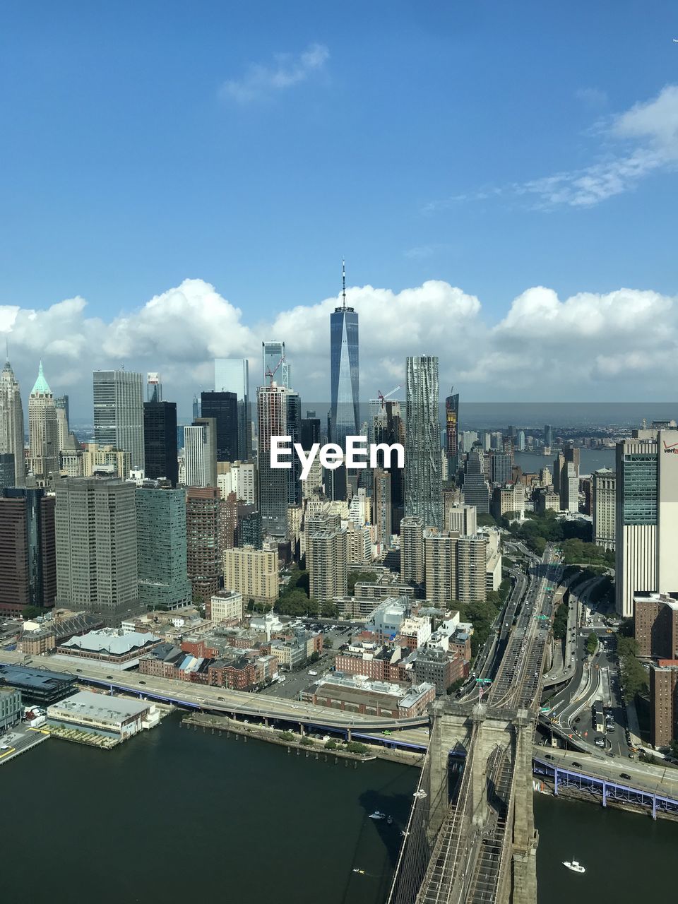 AERIAL VIEW OF BUILDINGS AGAINST SKY IN CITY