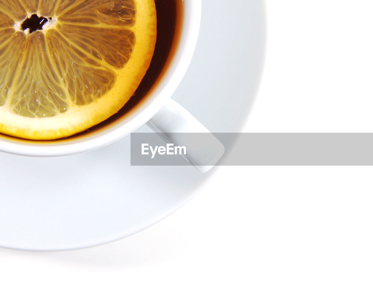 CLOSE-UP OF COFFEE CUP AND WHITE BACKGROUND