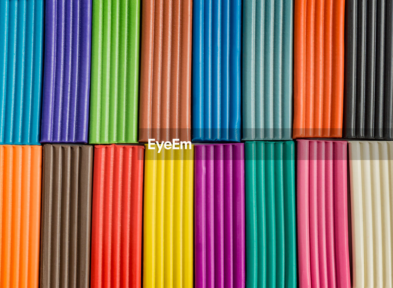 Rainbow colors of modeling clay. multicolored plasticine bars background.