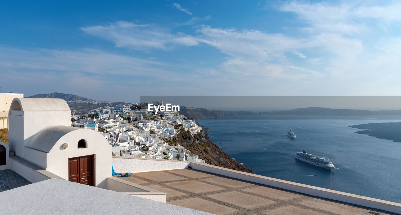 High angle view of buildings by sea