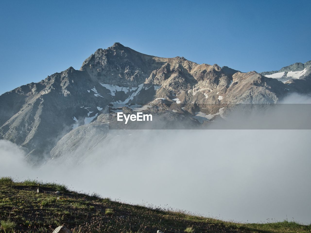 Scenic view of snowcapped mountains against clear sky