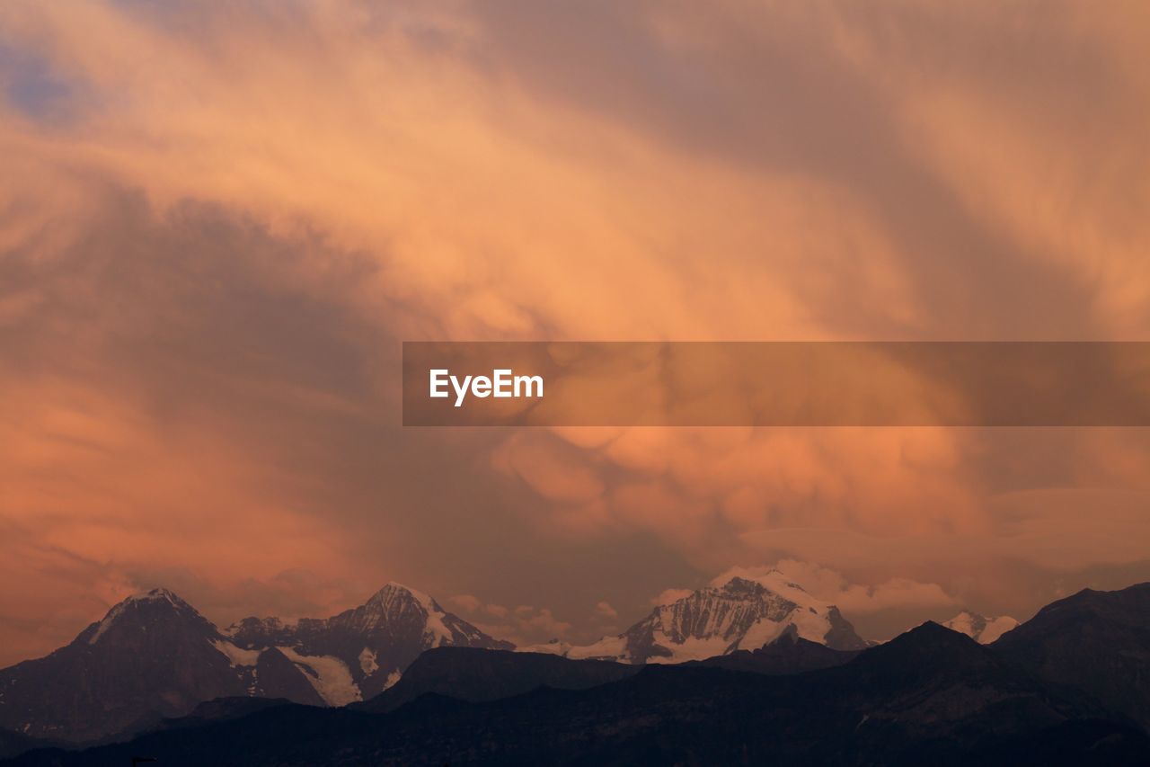 Scenic view of dramatic sky during sunset