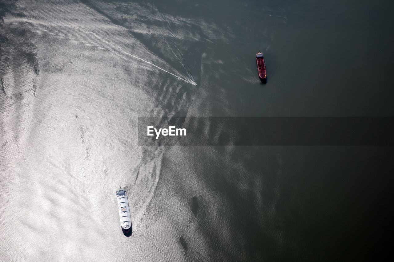 HIGH ANGLE VIEW OF PERSON BY WATER