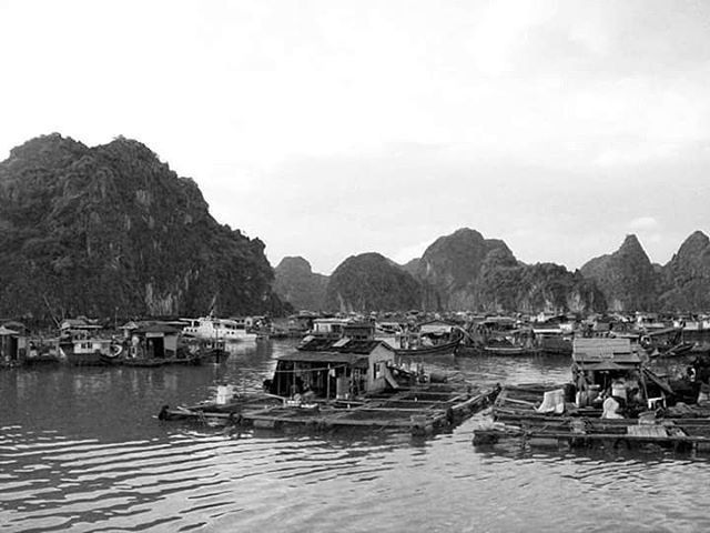 BOATS MOORED IN SEA