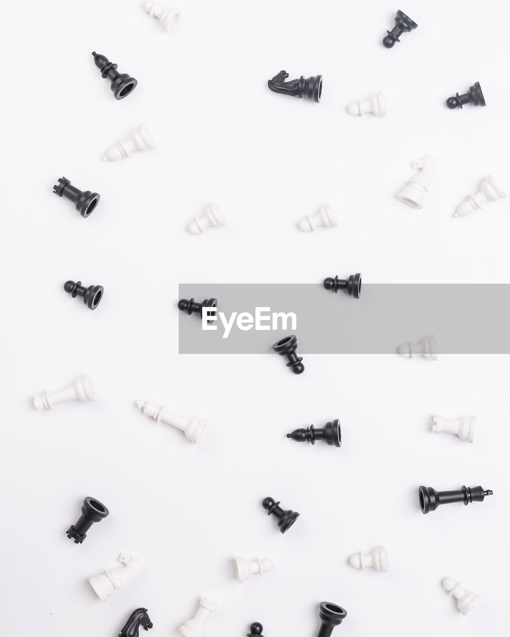 High angle view of chess pieces on white background