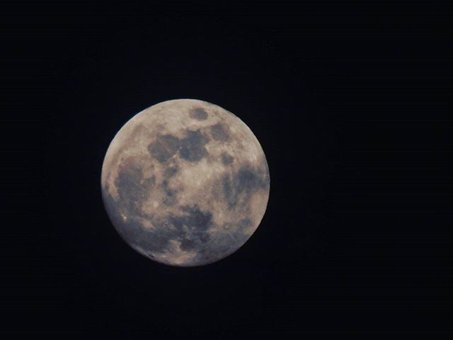 LOW ANGLE VIEW OF MOON IN THE DARK