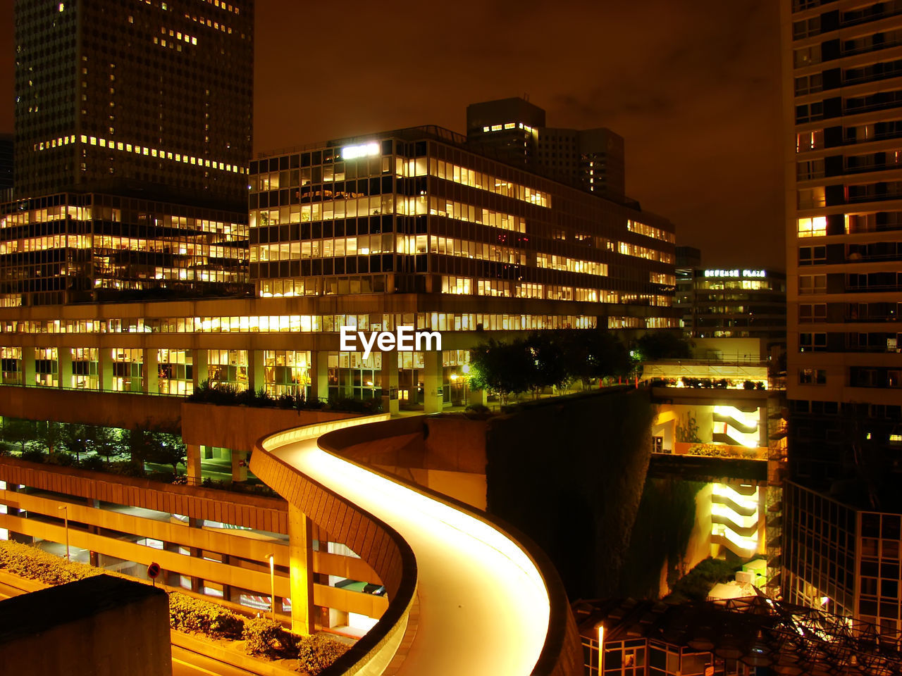 ILLUMINATED BUILDINGS AGAINST SKY AT NIGHT