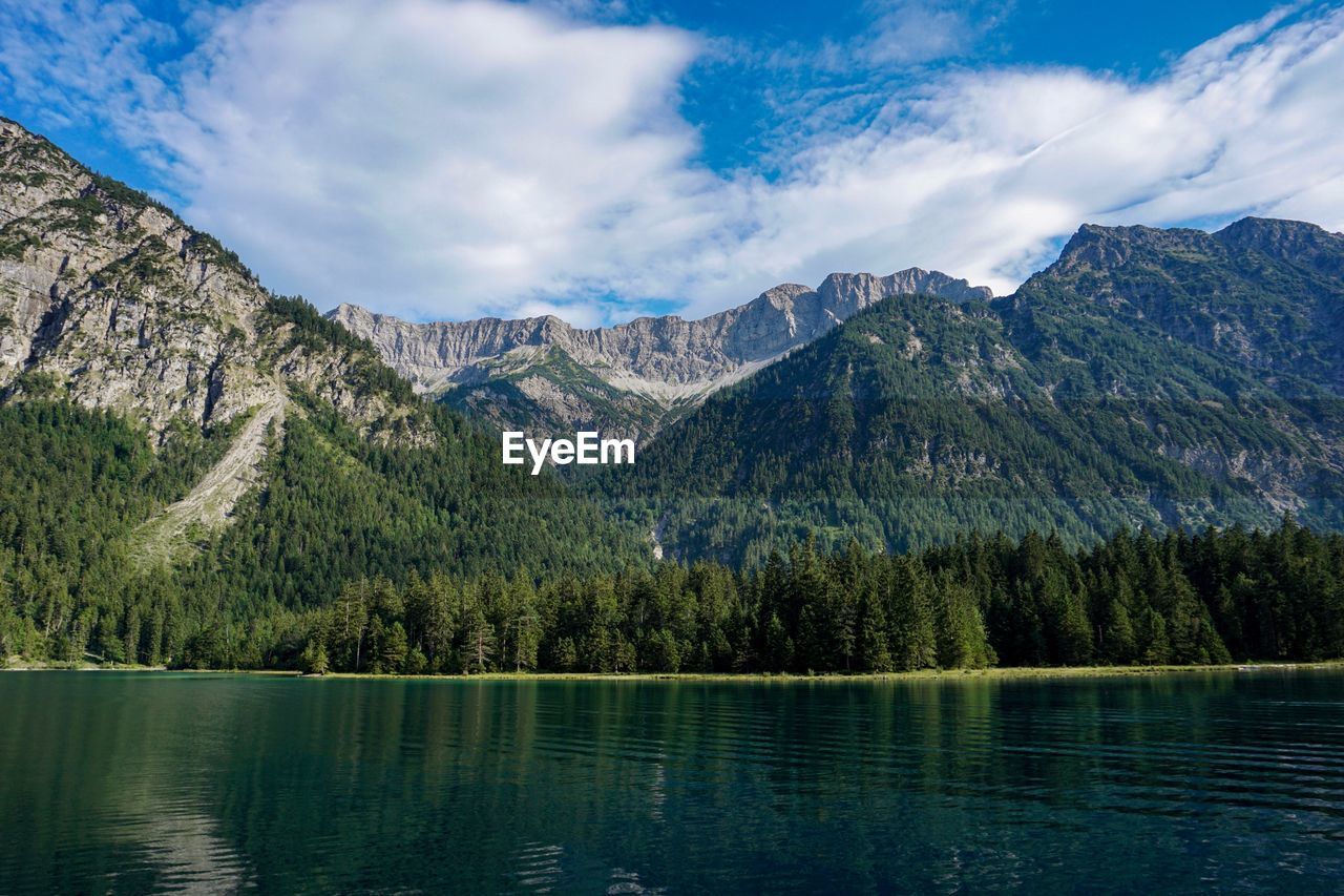 SCENIC VIEW OF LAKE BY TREES AGAINST SKY