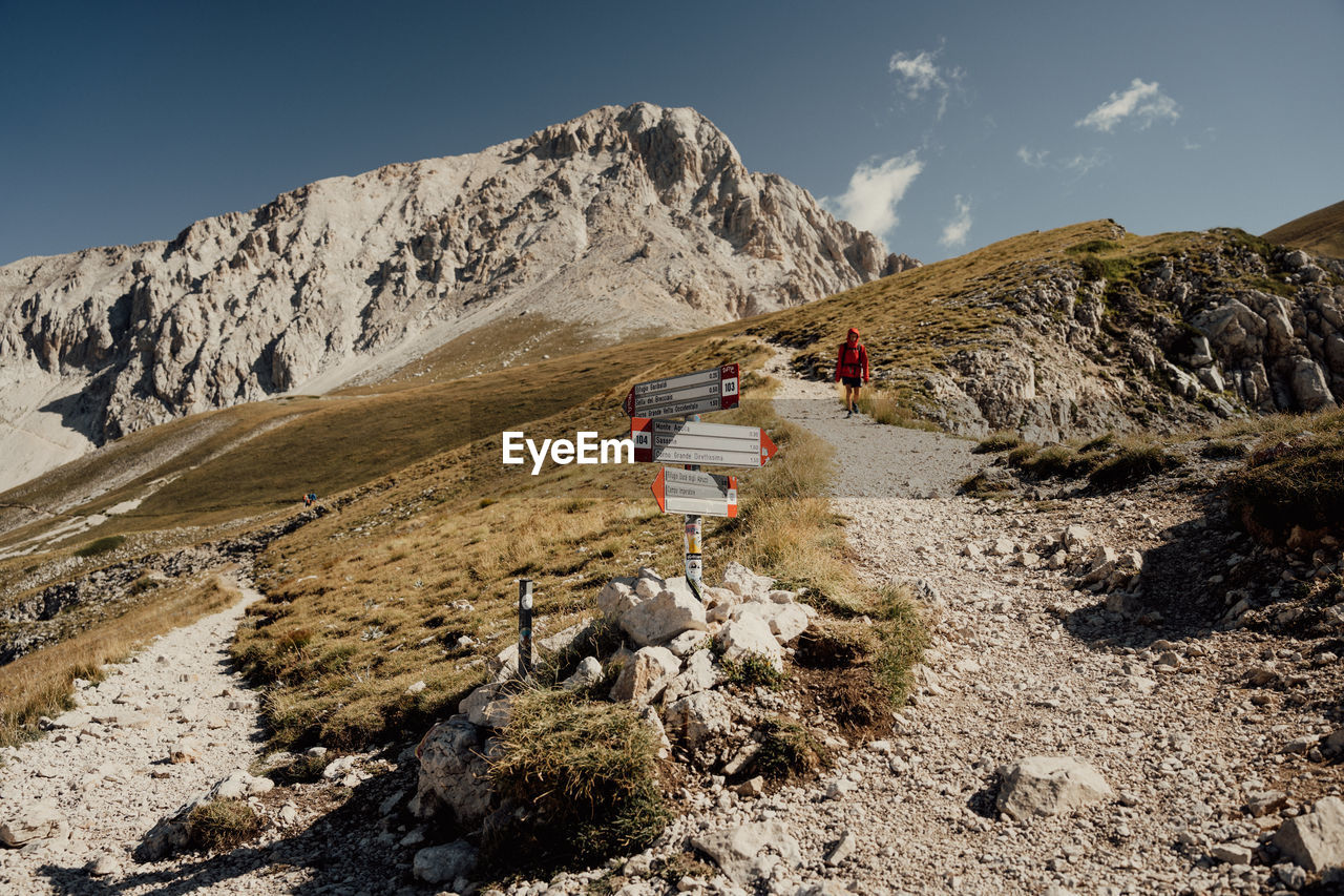 Rear view of man walking on mountain