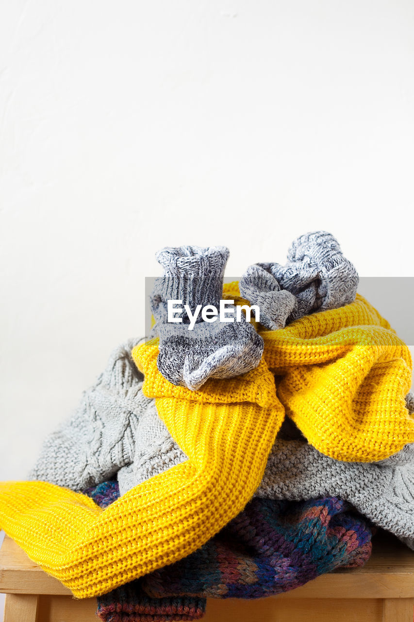 HIGH ANGLE VIEW OF MULTI COLORED PENCILS ON PAPER