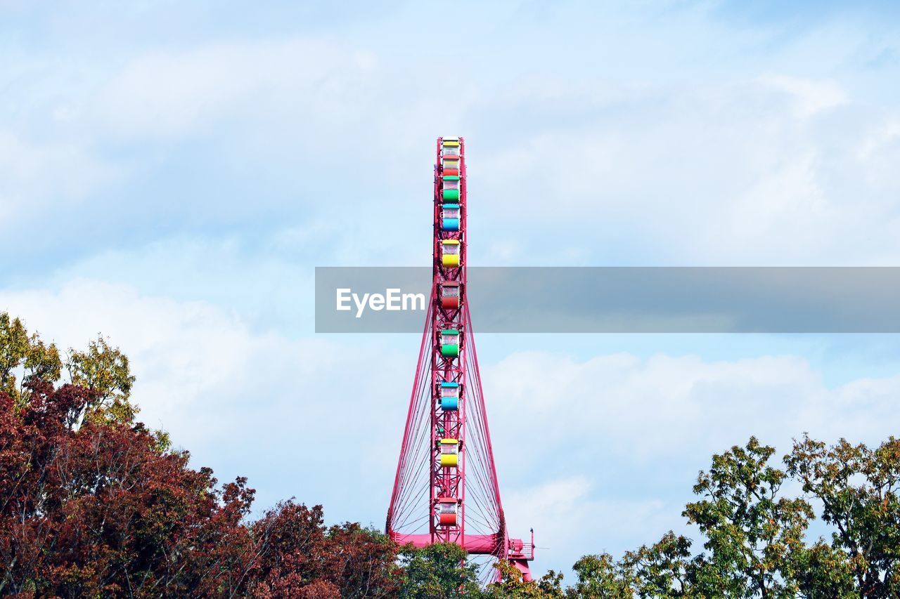 Low angle view of ferris wheel against sky