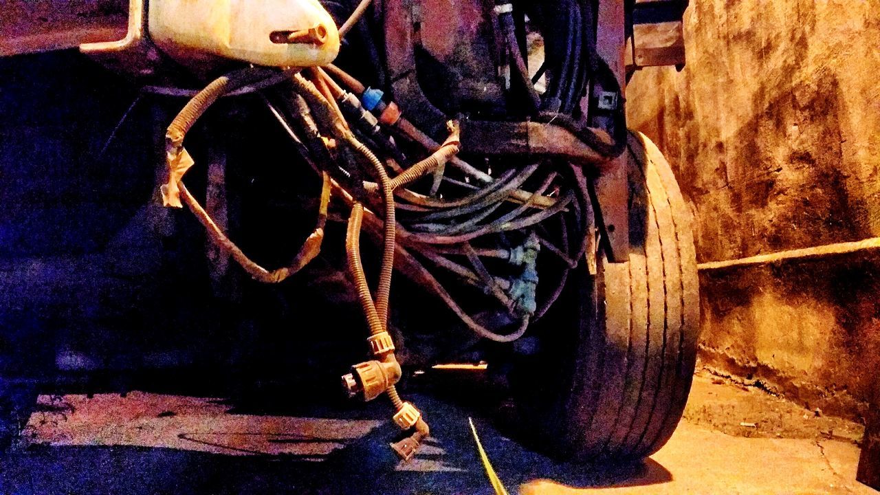 CLOSE-UP OF RUSTY ABANDONED CAR