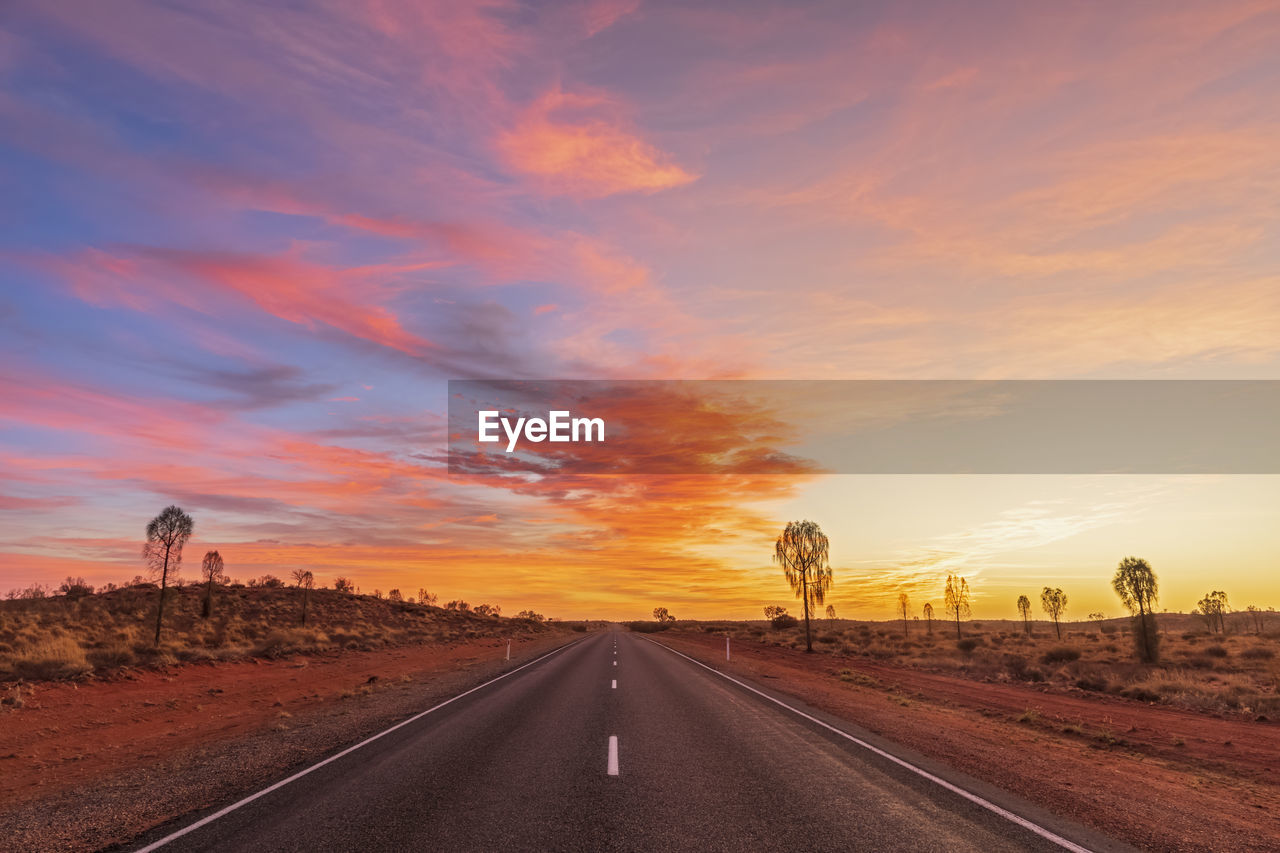 Lasseter highway at moody sunrise, australia