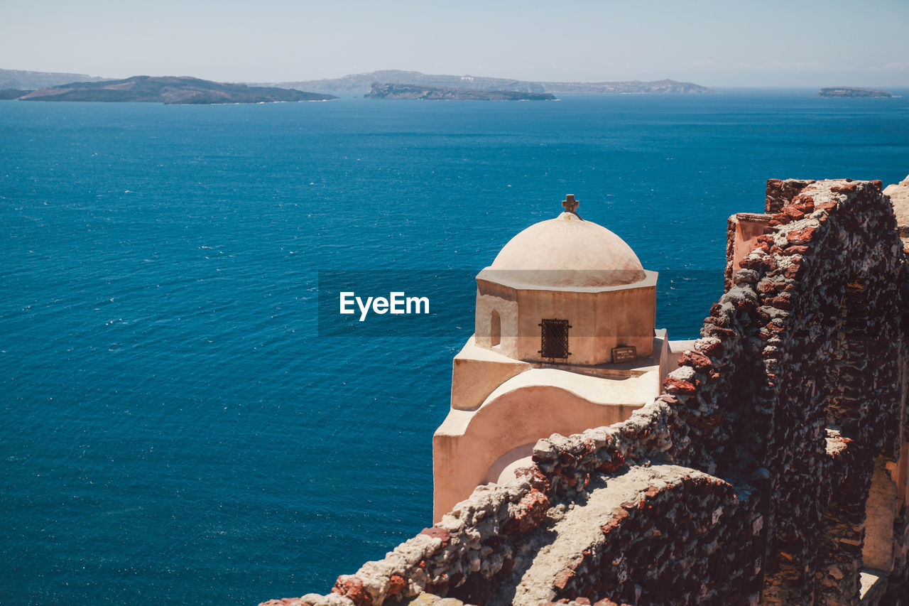 Old church against aegean sea at santorini