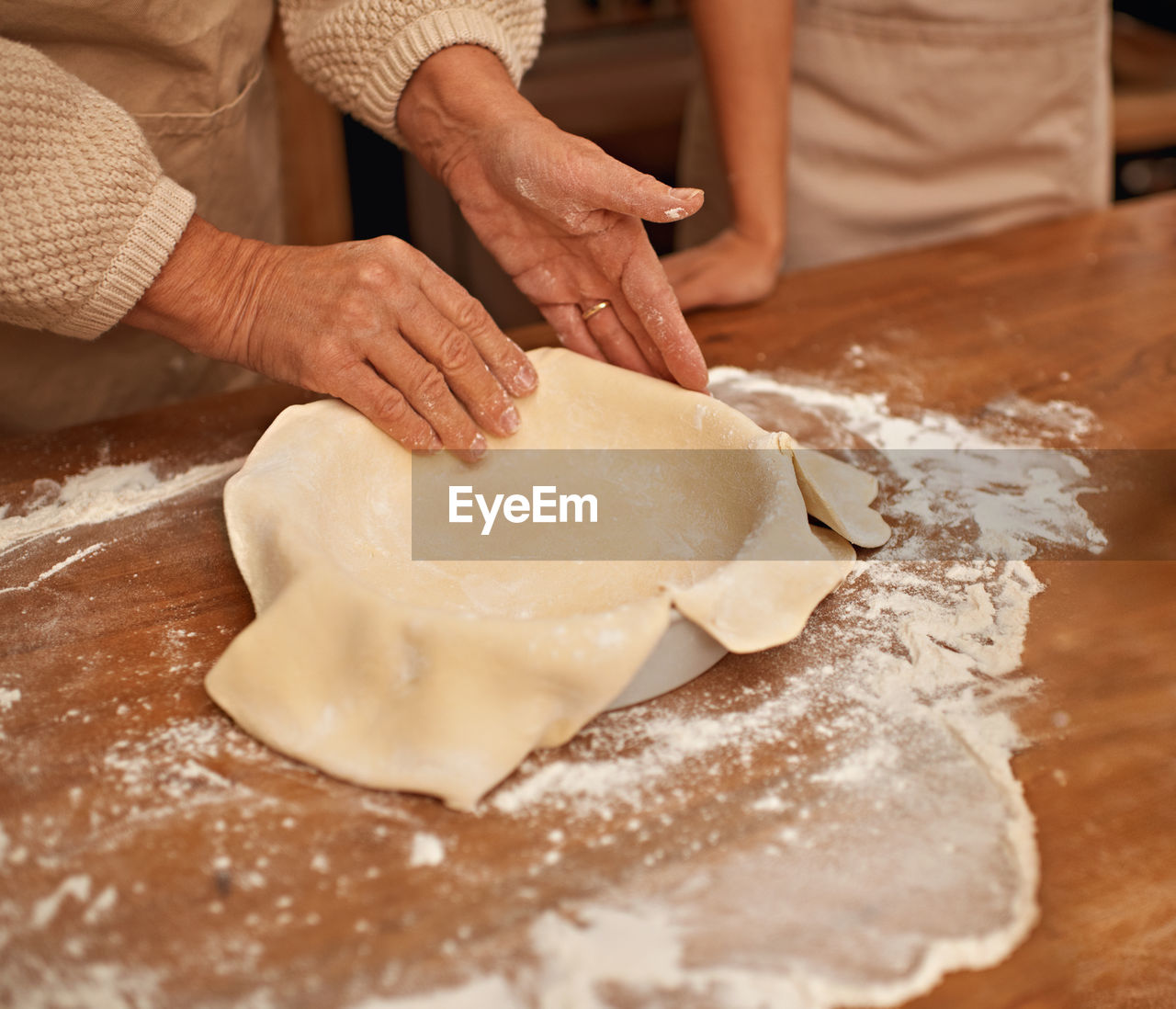 midsection of chef preparing food on table