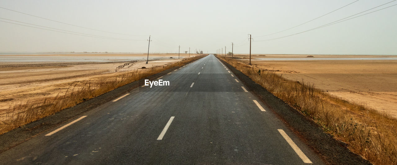 Road through senegalese nationial park in murky daylight