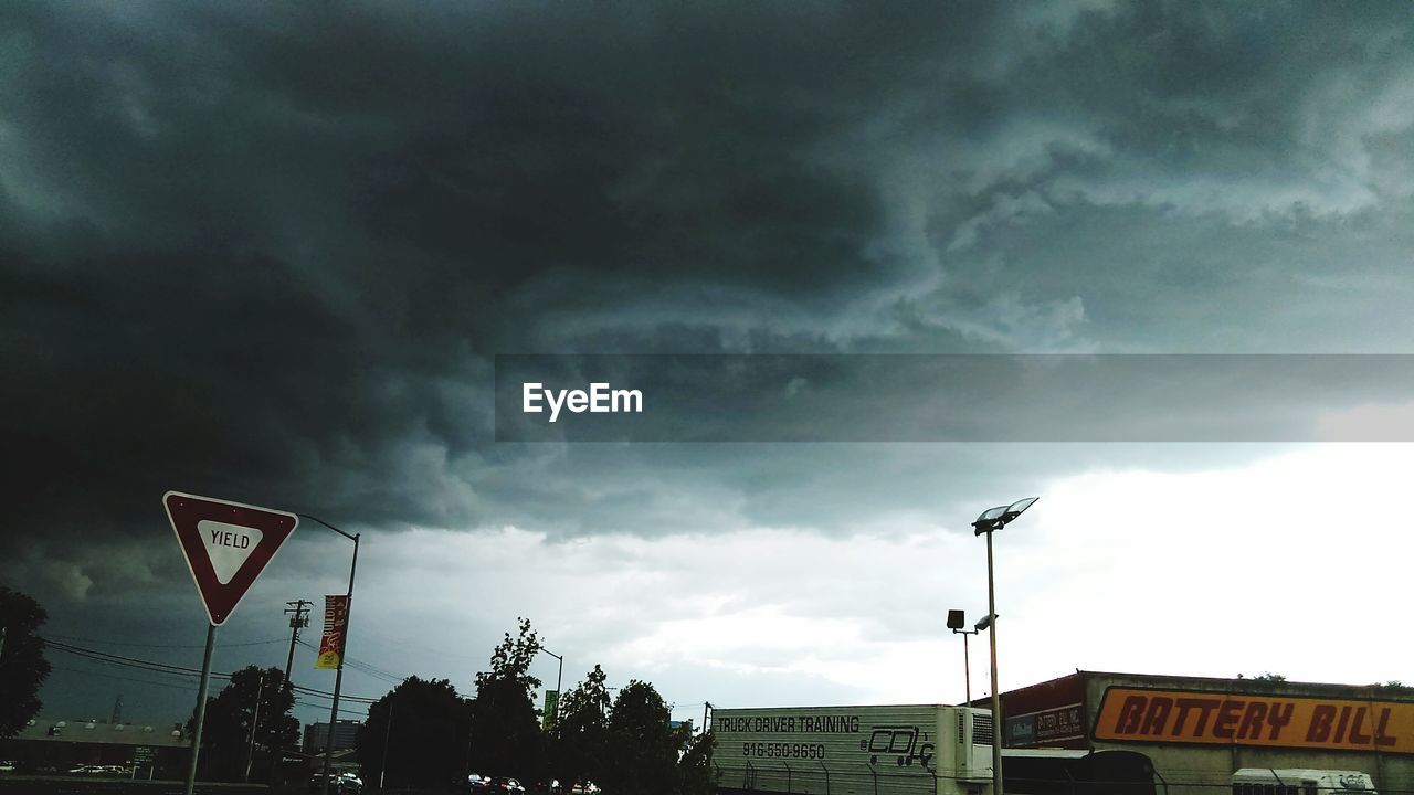 LOW ANGLE VIEW OF CLOUDY SKY OVER STREET