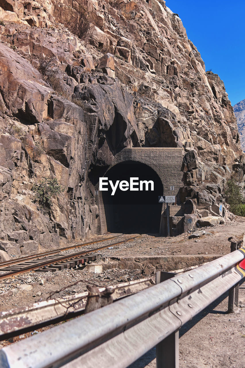 ARCH BRIDGE AGAINST ROCK FORMATION