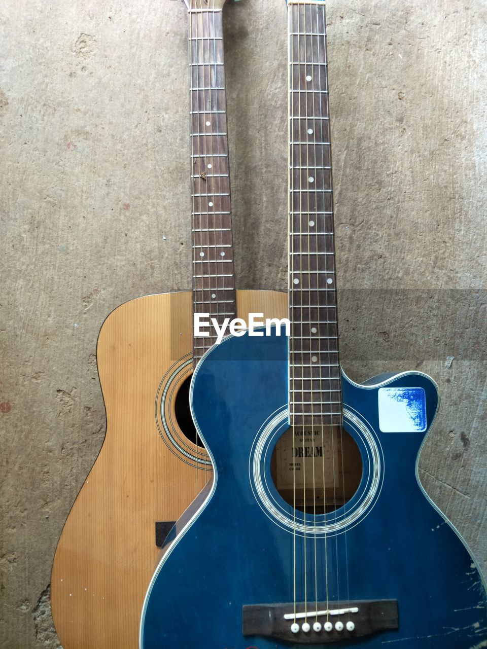 HIGH ANGLE VIEW OF GUITAR IN WALL