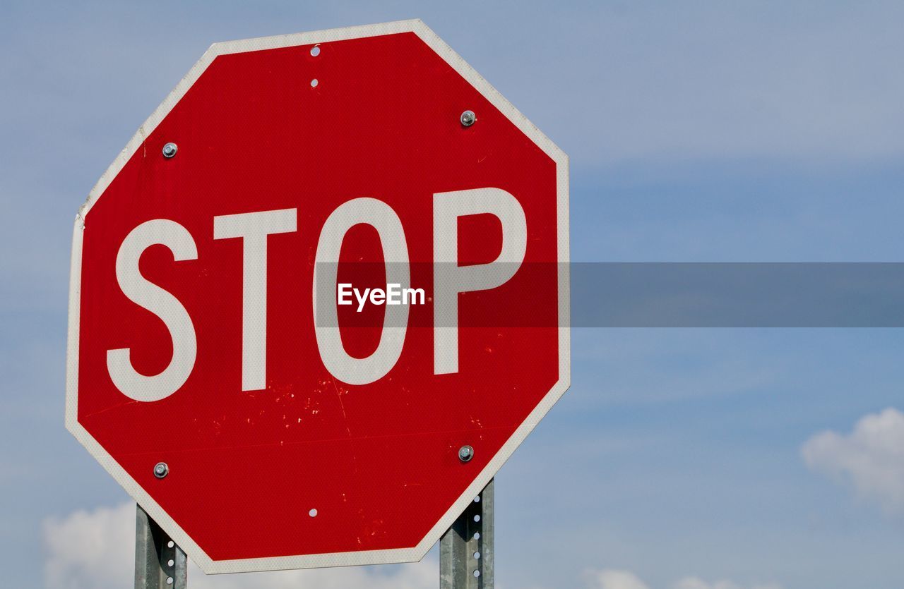 LOW ANGLE VIEW OF ROAD SIGN