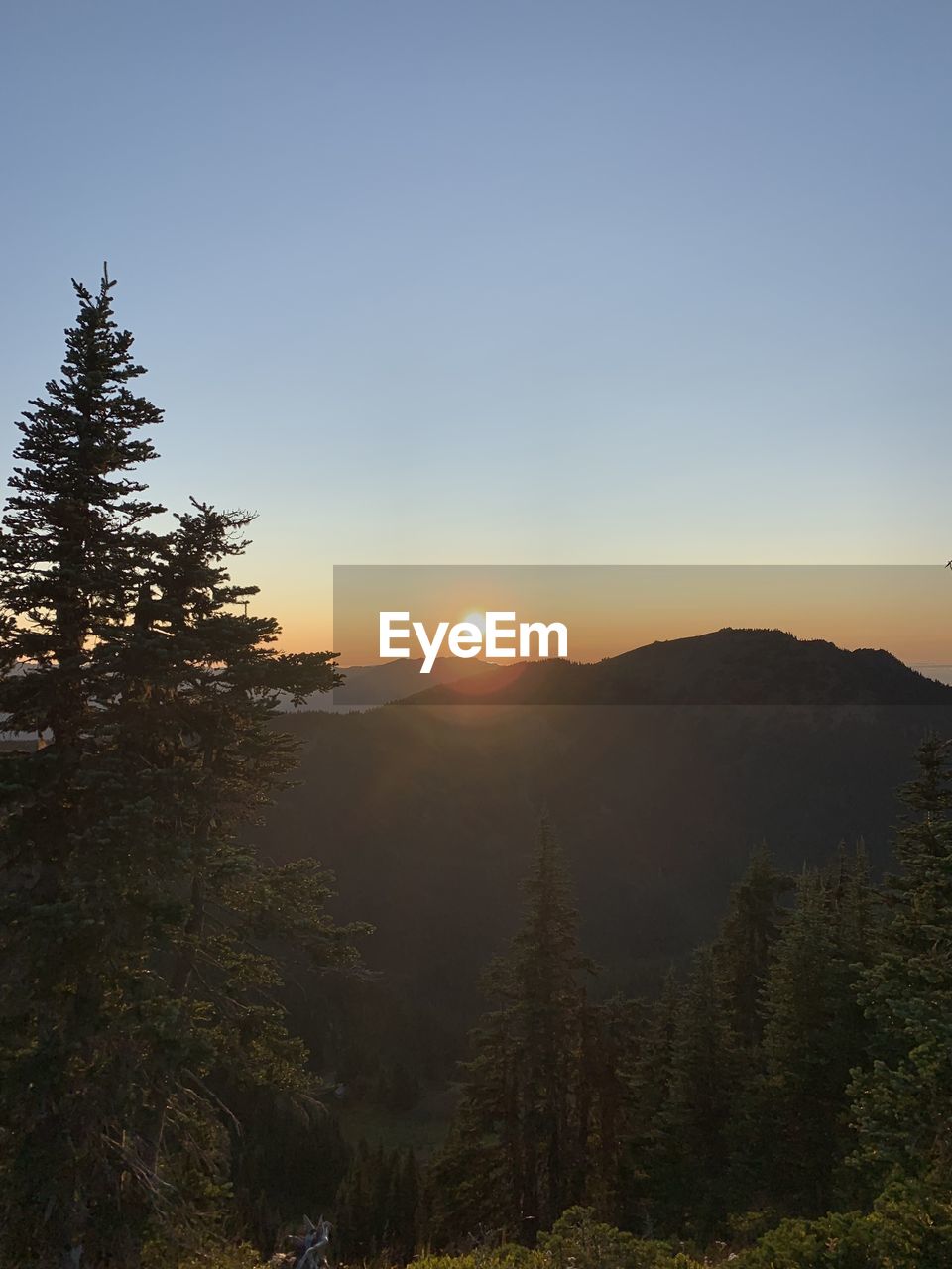 Scenic view of mountains against sky during sunset