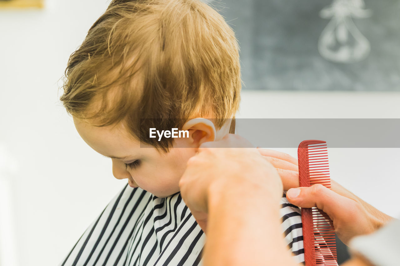 Boy getting haircut