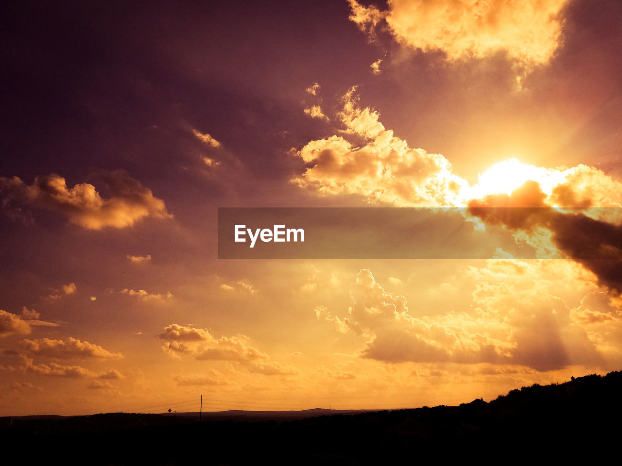 SILHOUETTE OF LANDSCAPE AT SUNSET