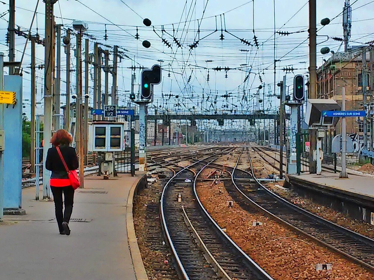 RAILROAD TRACKS ON RAILROAD STATION PLATFORM