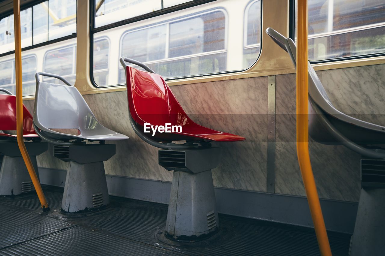 Empty seats in old tram of public transportation.