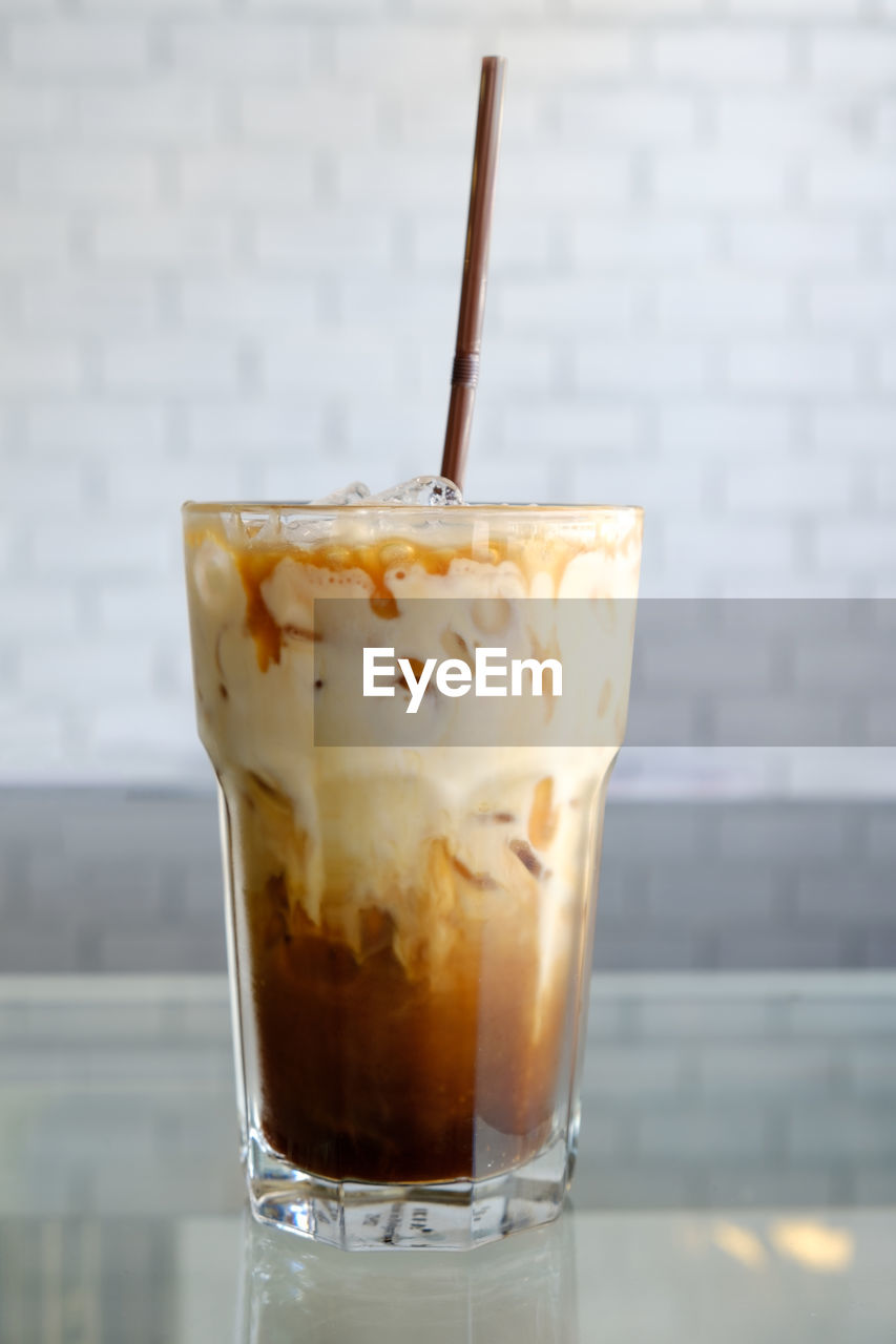 Close-up of coffee in glass on table