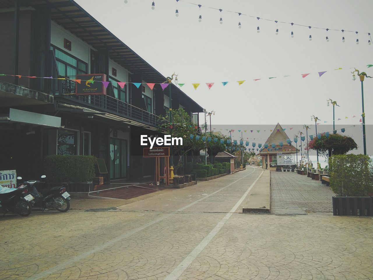 STREET AMIDST BUILDINGS IN CITY