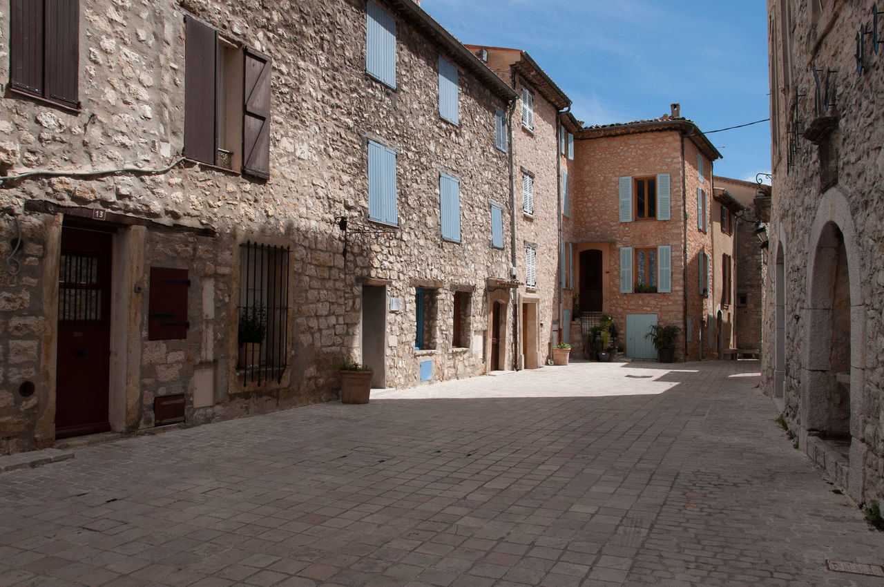 Footpath amidst buildings in town