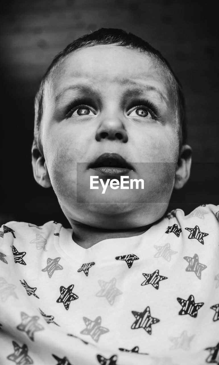 CLOSE-UP PORTRAIT OF BOY WITH BABY