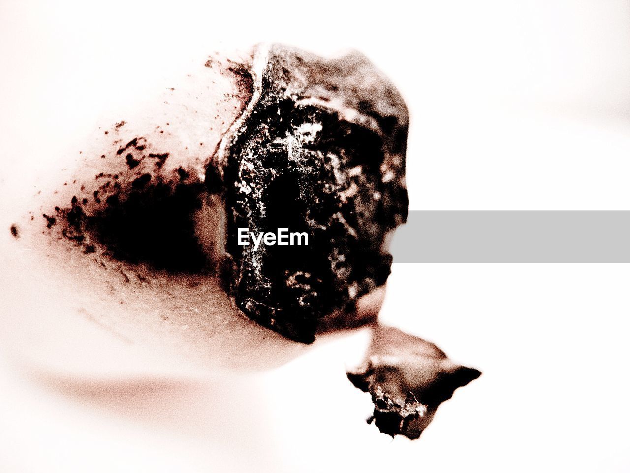 CLOSE-UP OF ICE CREAM OVER WHITE BACKGROUND