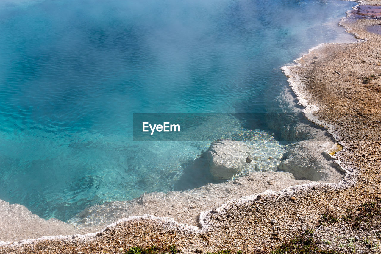 Brilliant blue thermal pool in west thumb basin in yellowstone national park