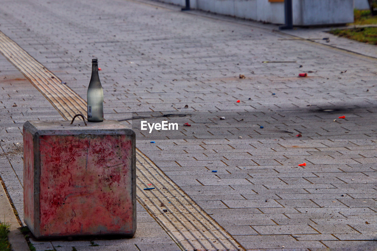 High angle view empty bottle on street