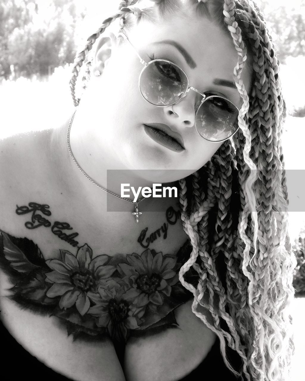 Portrait of young woman wearing sunglasses