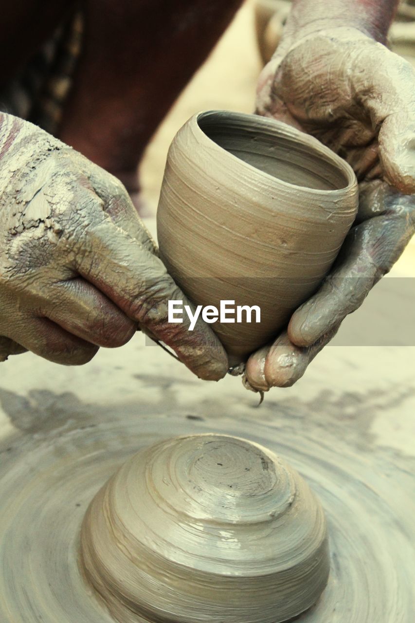Close-up of man pottery