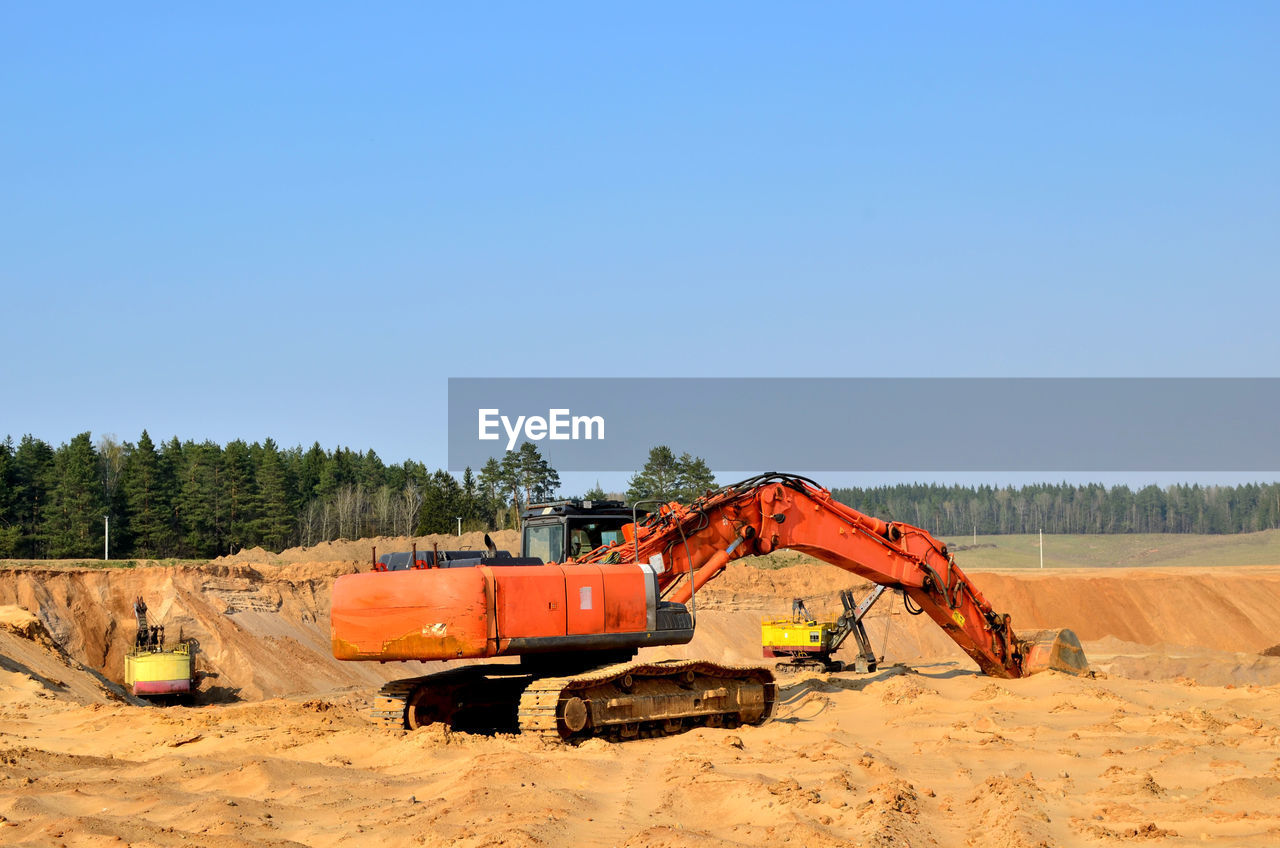 CONSTRUCTION SITE ON FIELD AGAINST SKY