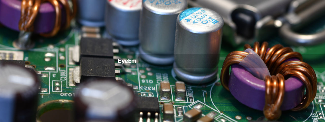 technology, electronics industry, industry, close-up, circuit board, computer chip, equipment, no people, computer equipment, electronic engineering, electronic device, selective focus, passive circuit component, electronics, computer, indoors, green, complexity, computer part