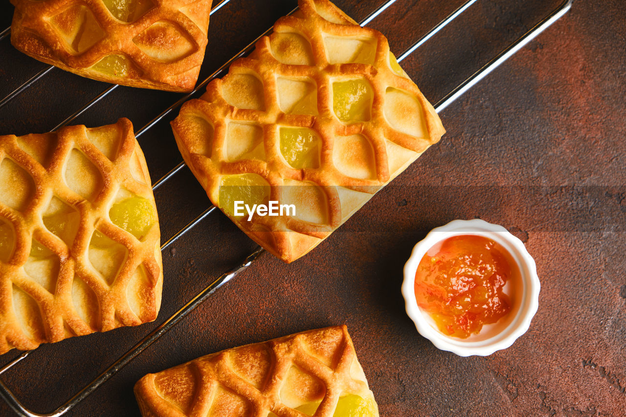 Fresh puff pastry mini pies with pear and lime jam