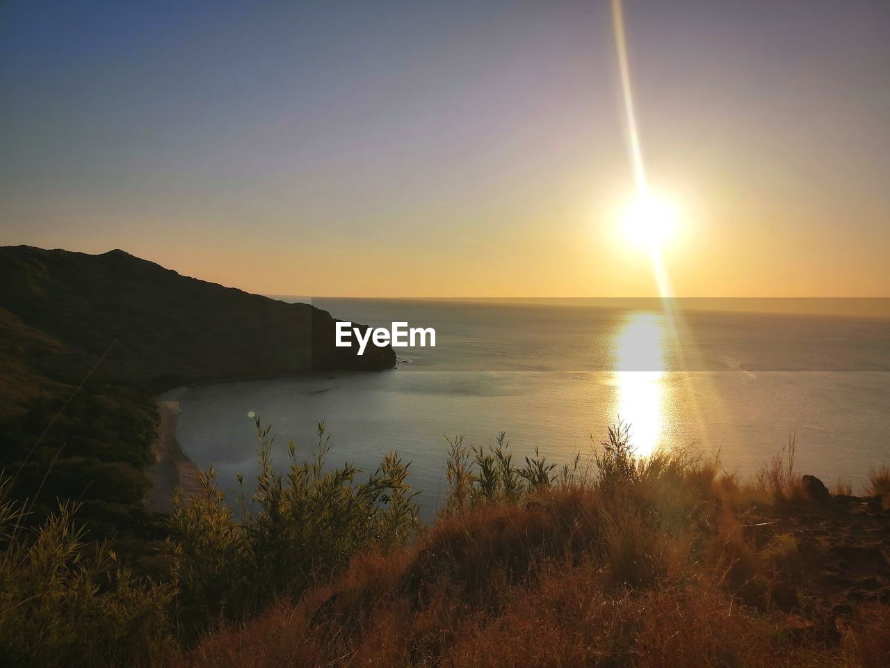 Scenic view of sea against sky during sunset