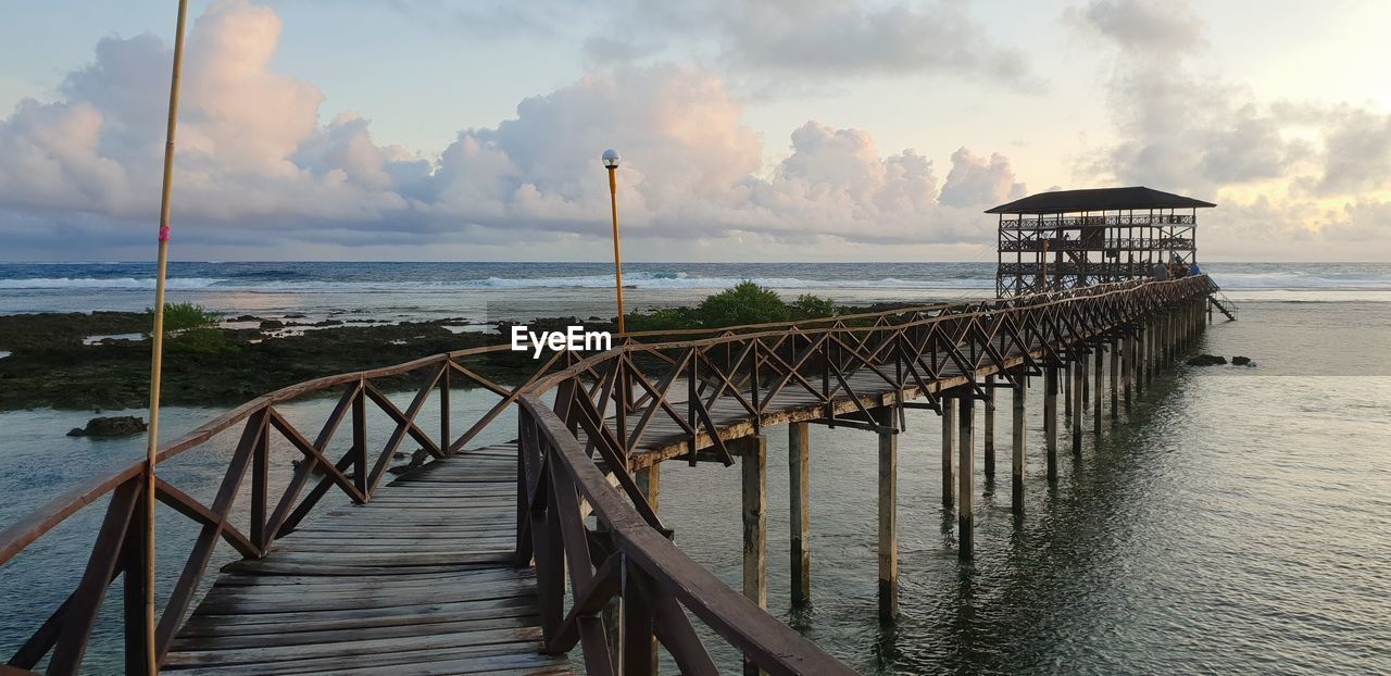 Pier over sea against sky