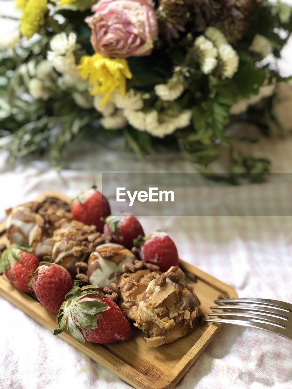 High angle view of dessert with flowers on table