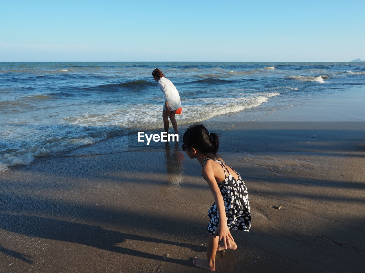 Full length of woman on beach against sky