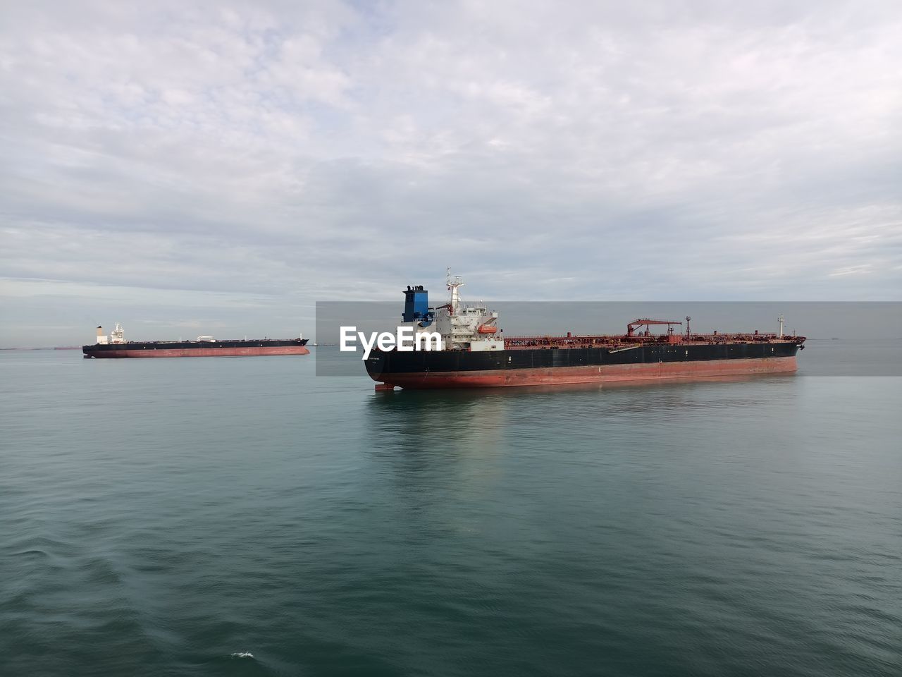 Boats in sea against sky